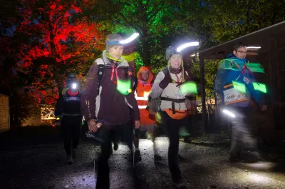 Walkers in the dark with head torches 