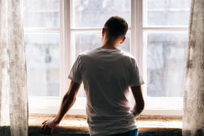 Young man at window