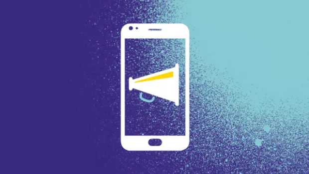 A white mobile phone with a megaphone,  on a purple background with blue spray paint